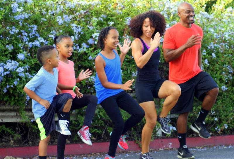 Image of family of five running in place