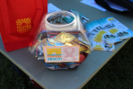 Picture of a Jar of condoms and HIV testing educatin pamphlets.