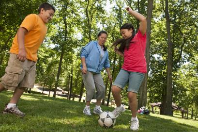 Picture of kids recreationally playing soccer.