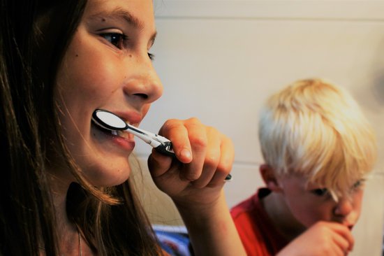 Kids brushing their teeth.