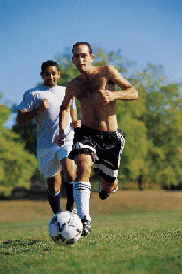 Young men playing soccer