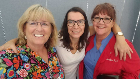 Three school health nurses posing for a picture.