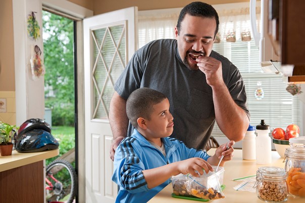 father and son eating
