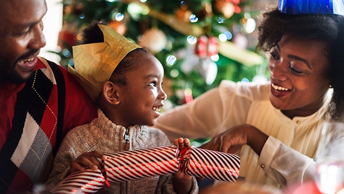 family celebration with Christmas tree in background