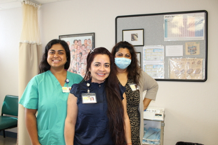 three staff members posing
