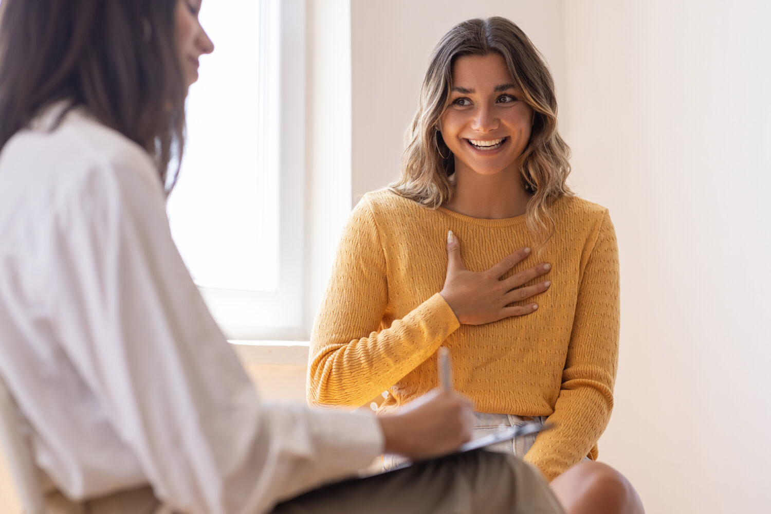 Woman speaking to a health care provider at a clinic