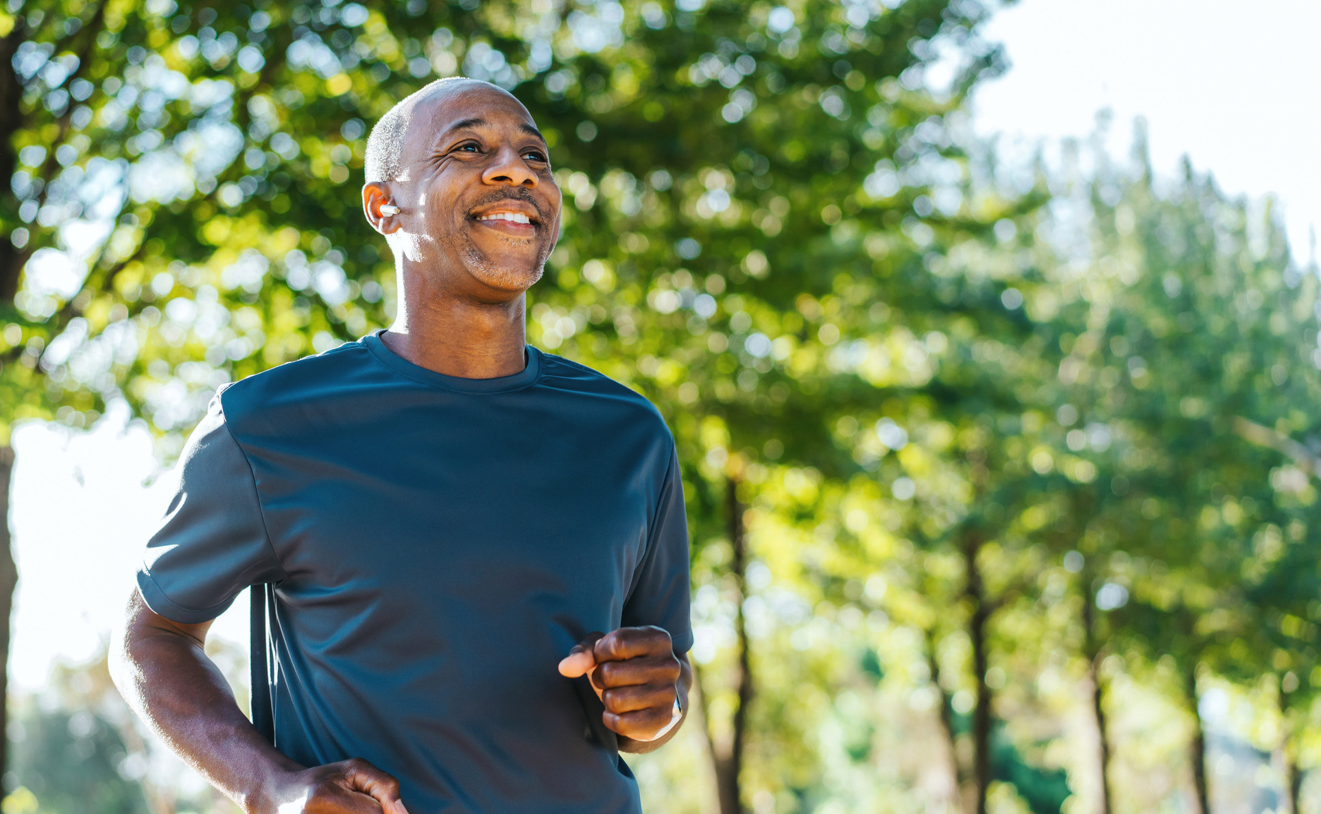 Portrait of a mature man running in the public park