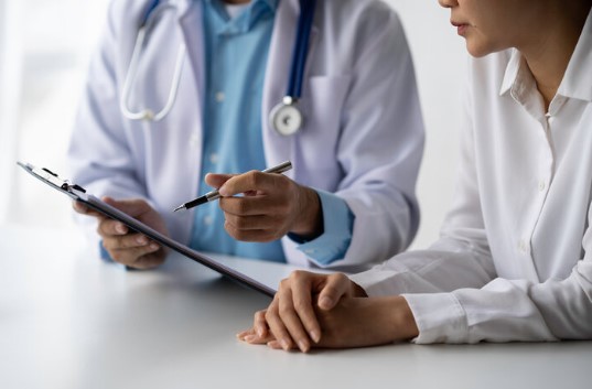 Image of doctors looking at clipboard